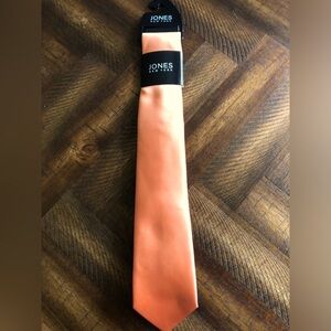 Jones New York tie.  Light orange.  New. 100% polyester